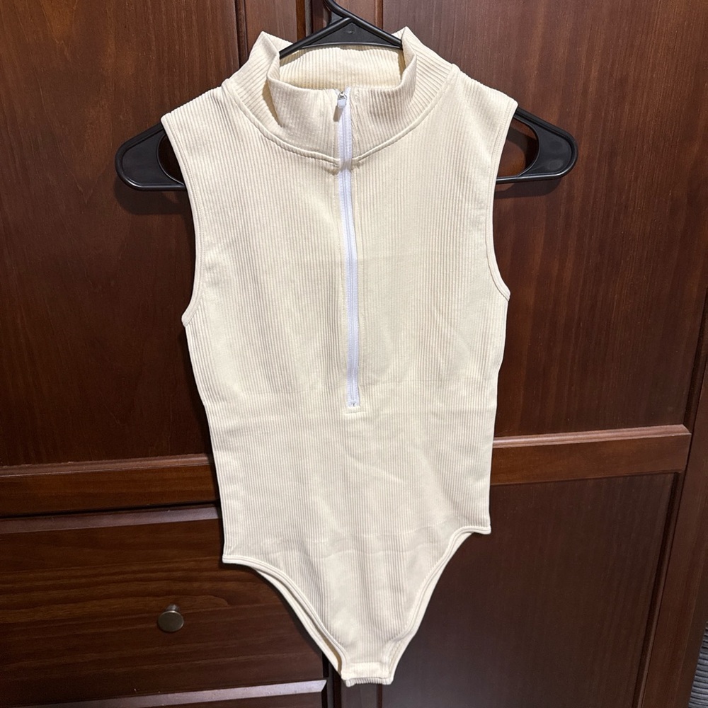 Sleeveless Ribbed Zip-Front Baby Bodysuit in Cream